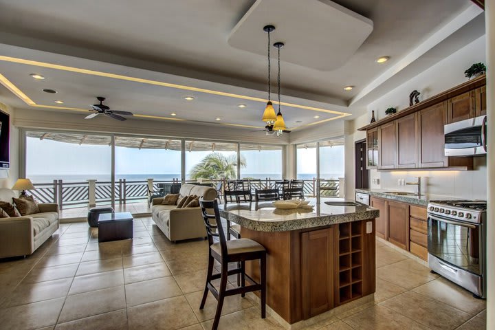 The master suite has a sitting area, a kitchen, and ocean view