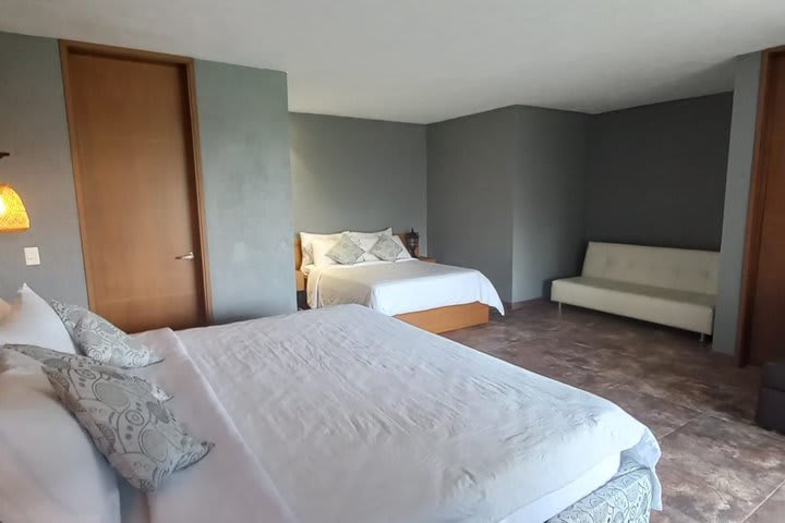 Habitación queen con sofá cama