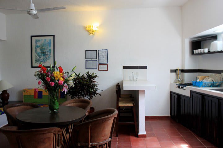 Equipped kitchen in a junior suite with balcony