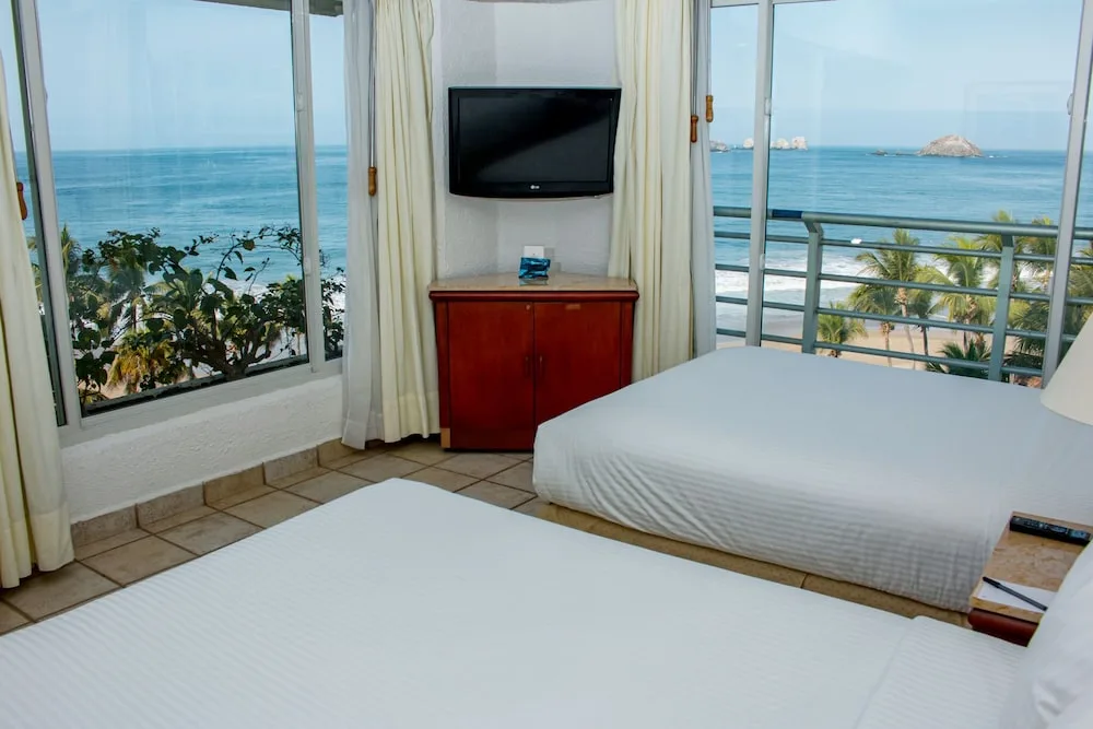 Img - Suite junior, 2 camas dobles, vista al océano