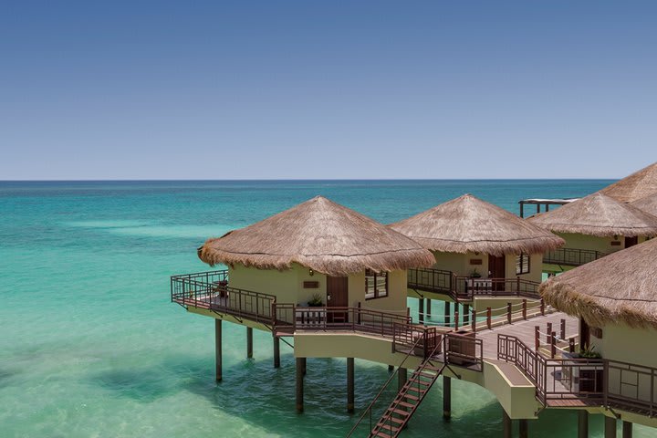 Rustic cabins built over the sea