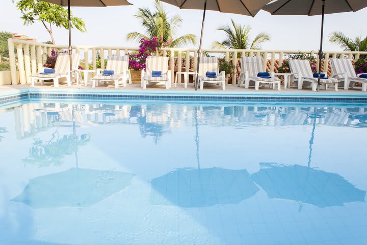 Sun loungers next to the pool