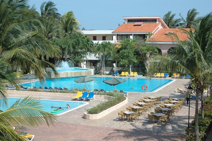 View of the pool with sun loungers