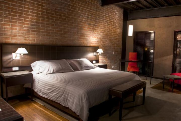 Guest rooms at the Art Hotel Medellin offer simple decor