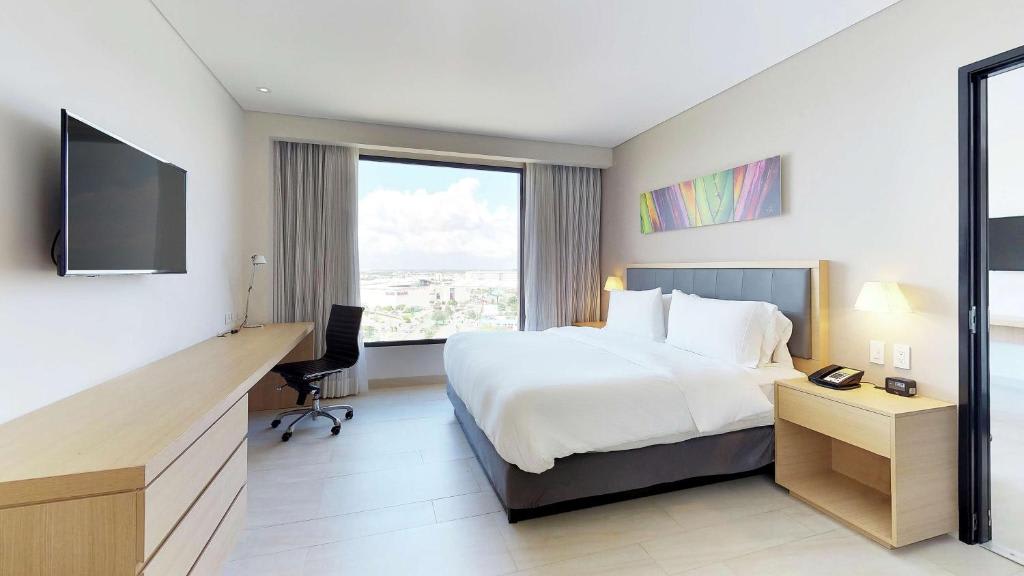 Suite Junior con cama extragrande y zona de estar