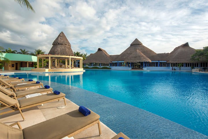 The pool area has sun loungers