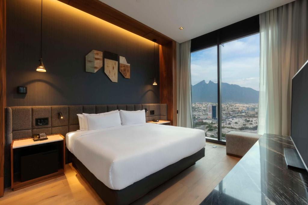 Suite con acceso al salón Club y cama extragrande