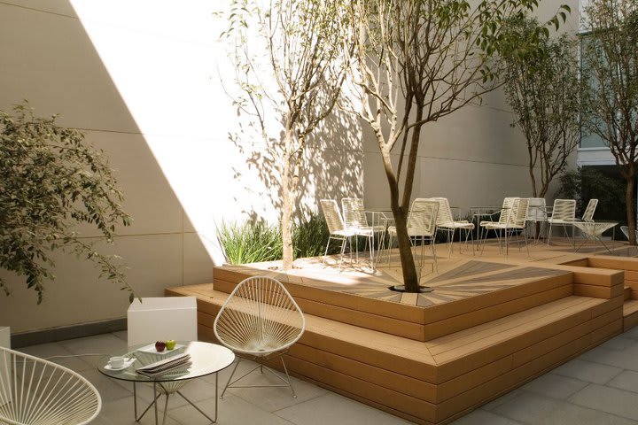 The terrace area has modern furniture