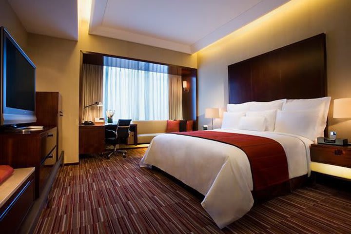 Rest in one of the guest rooms at the Renaissance Shanghai Zhongshan Park Hotel