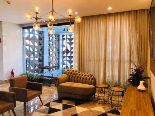 living room with sofa, chairs and table at Arca's Hotel, in Toledo
