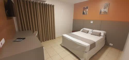 A bed or beds in a Liv Hotel room