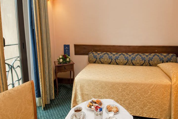 Single guest room at the Ambasciatori Palace hotel in Rome