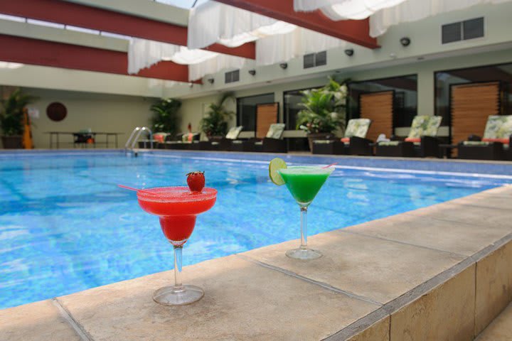 The hotel offers beverage service in the pool area