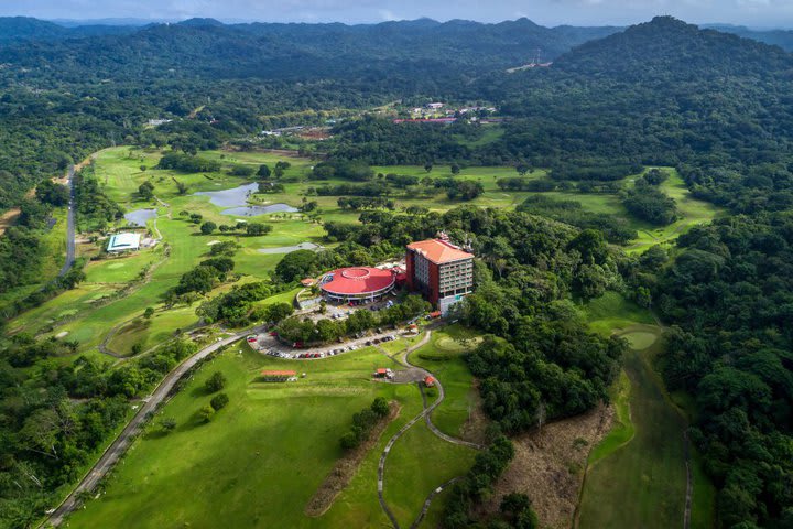 Hotel surrounded by extensive areas with lush tropical vegetation