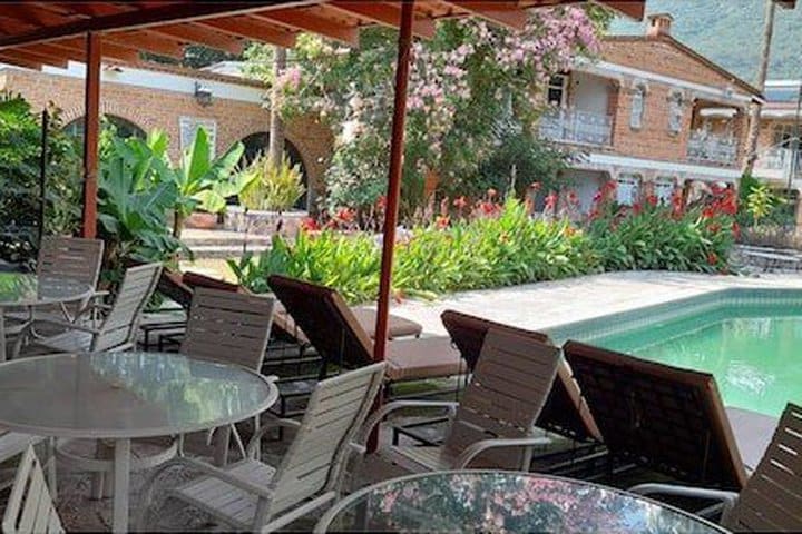 Tables next to the pool