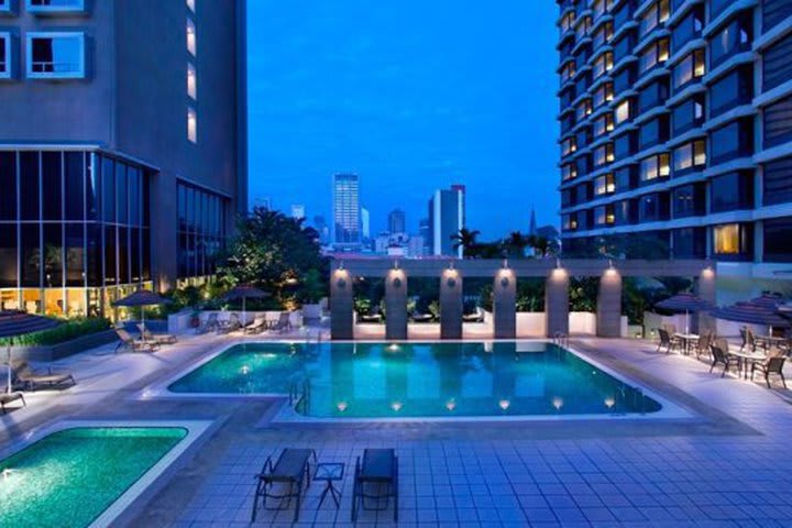 Enjoy the outdoor pool at the Carlton Hotel in Singapore