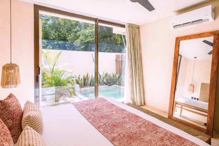 Bed in a studio with private pool and jungle view