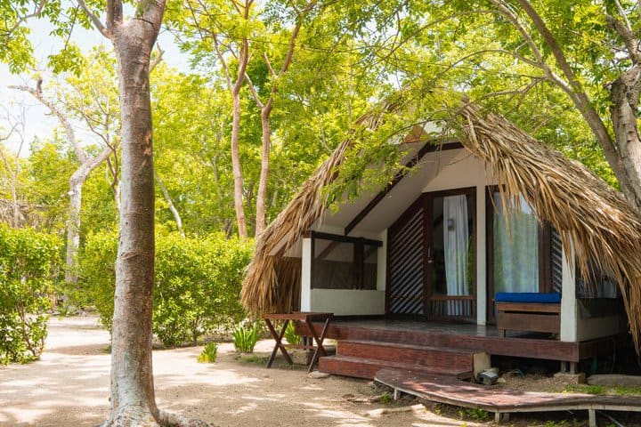 Exterior view of a cabin in front of the beach