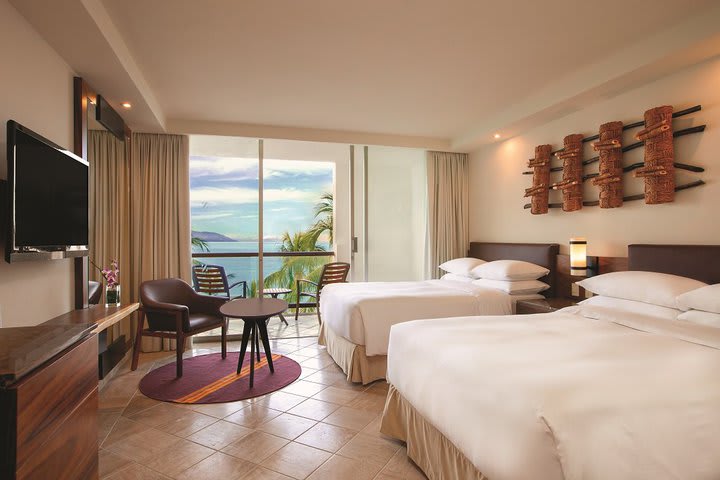 Room with balcony and ocean view