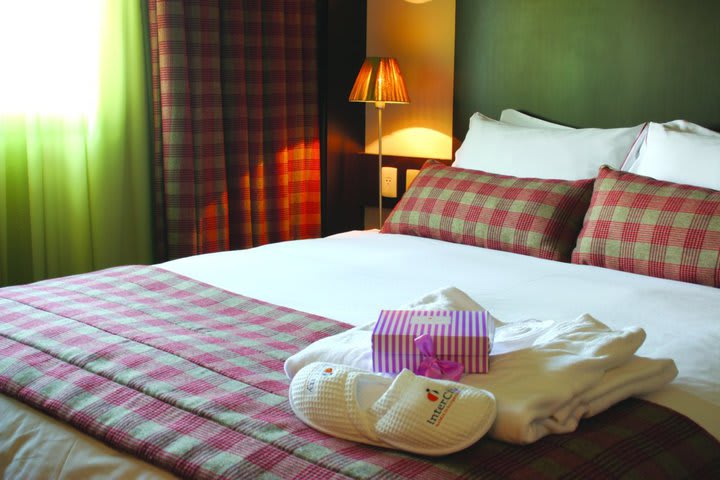 Guest rooms at the InterCity Premium hotel in Porto Alegre offer bathrobes and slippers