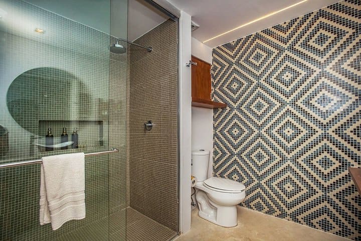 Bathroom with shower in a Grand guest room with jungle view