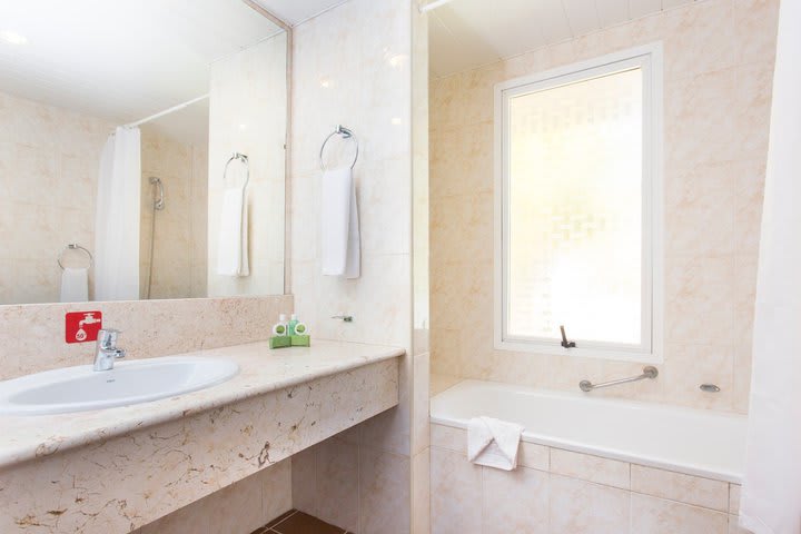 Private bathroom with tub in a junior suite