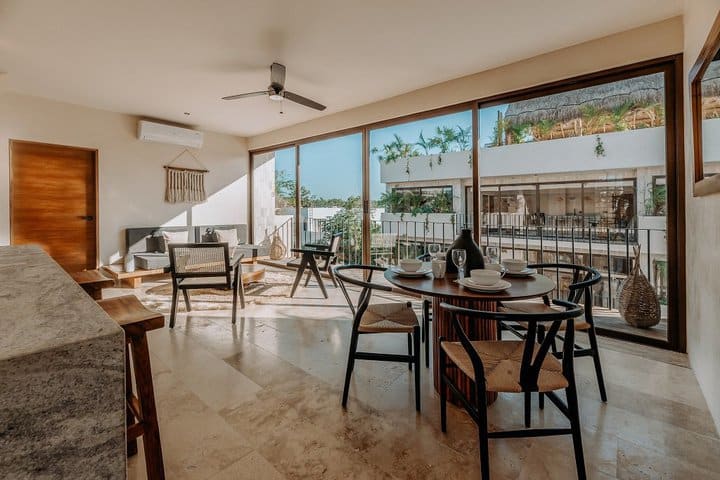 Dining and sitting area of a suite with 1 bedroom