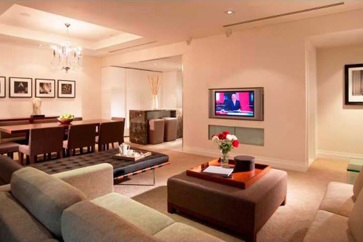 Guest room with a sitting area at the Carlton Singapore hotel