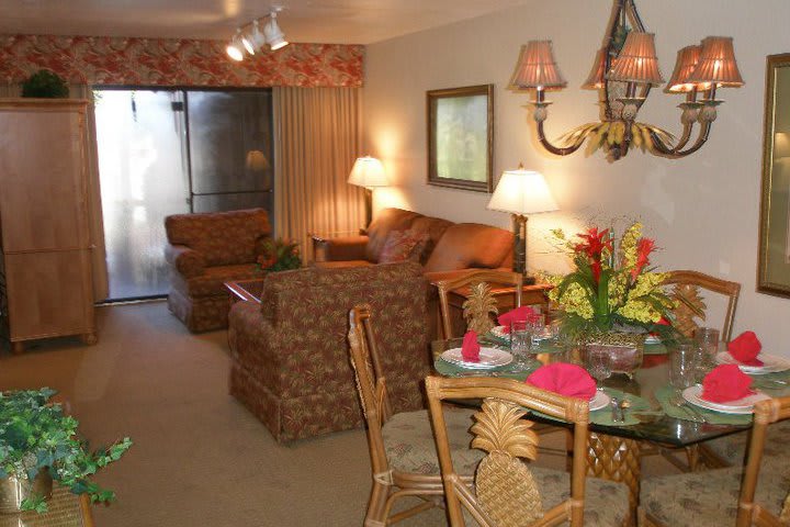 Dining and sitting areas in a villa at the Polynesian Isles hotel
