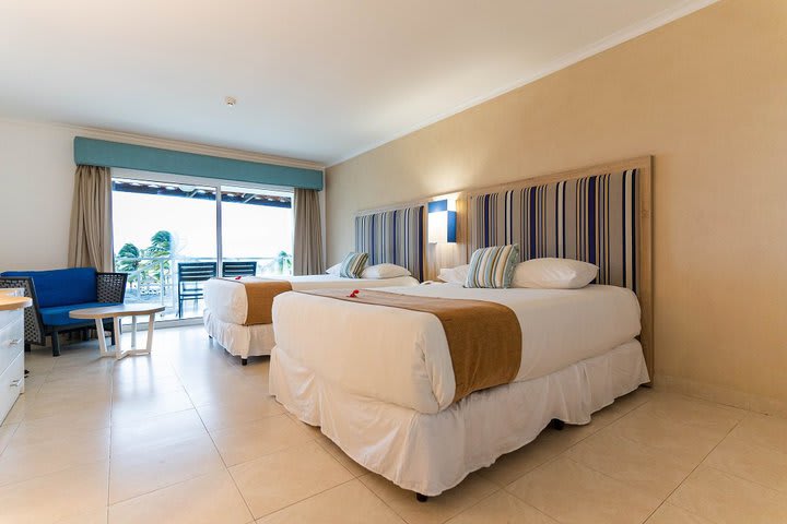 Guest room with two beds and ocean view