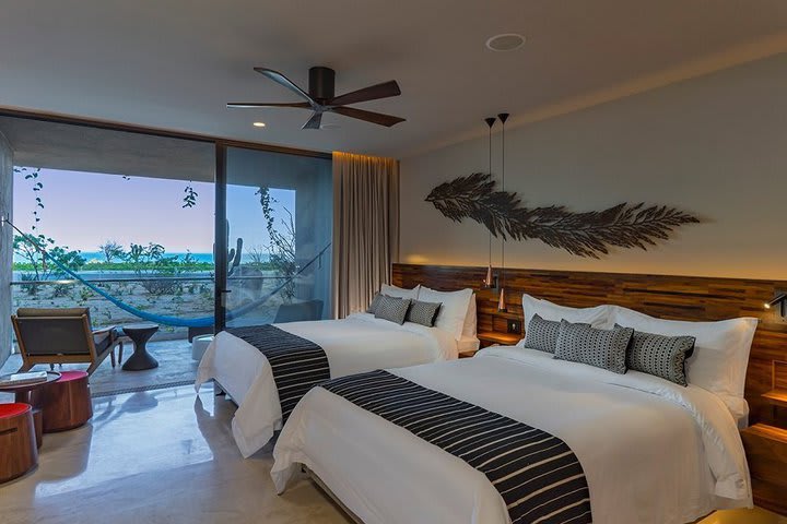 Guest room with queen size beds and ocean view