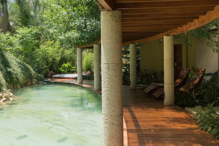 Sun loungers next to a pool