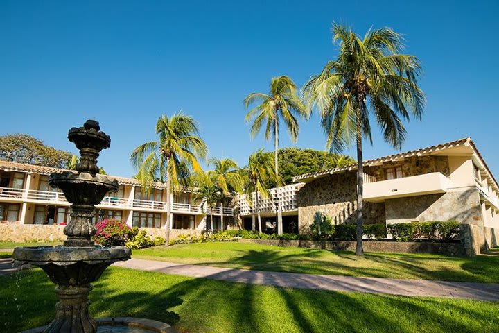 The hotel is surrounded by tropical gardens