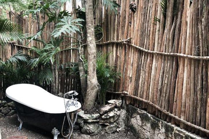 Outdoor tub in the jungle studio