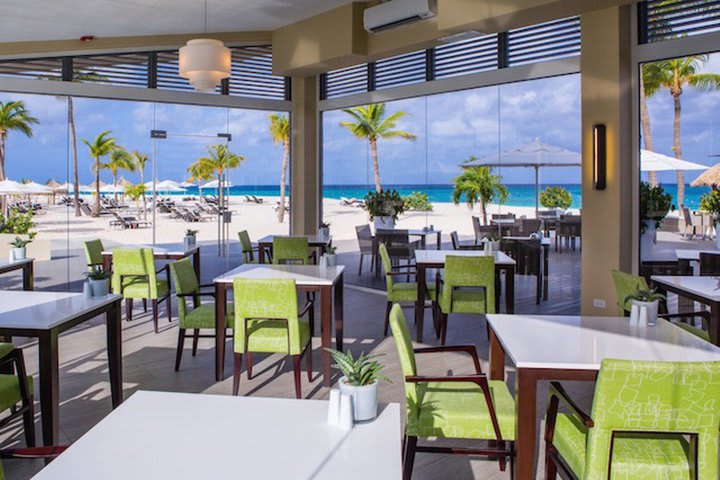 Restaurant with floor-to-ceiling windows with ocean view