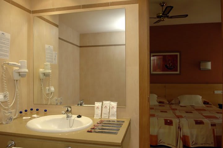 Guest rooms at the Fiesta Tanit hotel have a private bath