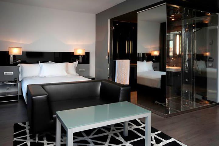 Guest room with sitting area at AC Hotel by Marriott Atocha in Madrid