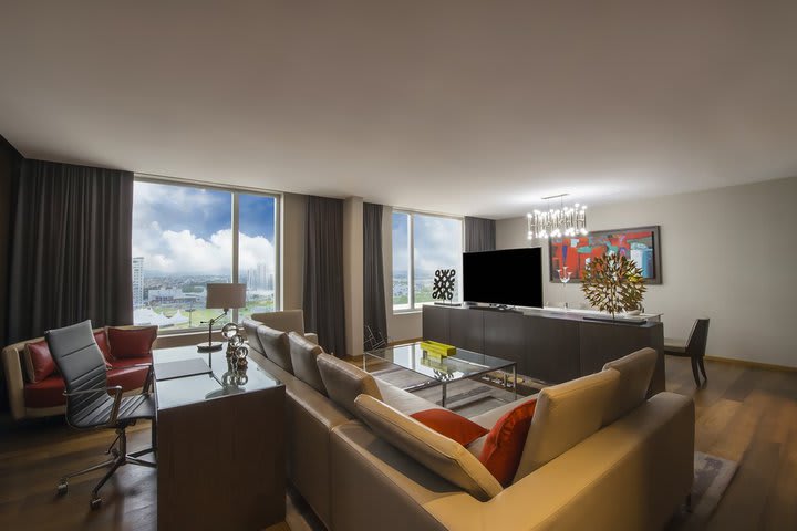 Sitting area of a presidential suite with work desk