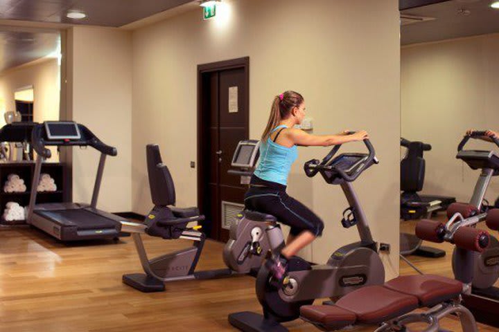 Work out in the fitness center at the Atahotel in Rome