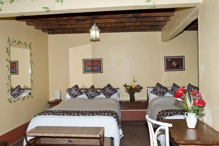 Guest rooms have footboards with Mazahua embroidery