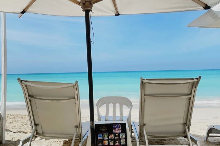 A shade and sun loungers on the beach