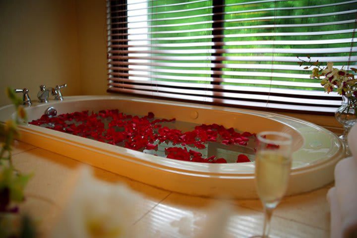 Private guest bathroom with whirlpool tub in a suite