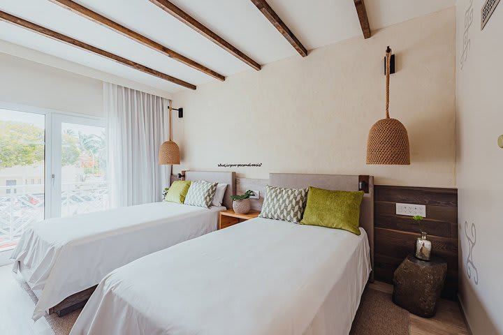 Guest room with two beds and island view