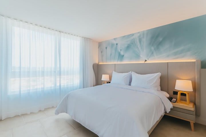 Master bedroom of a suite with two bedrooms and island view