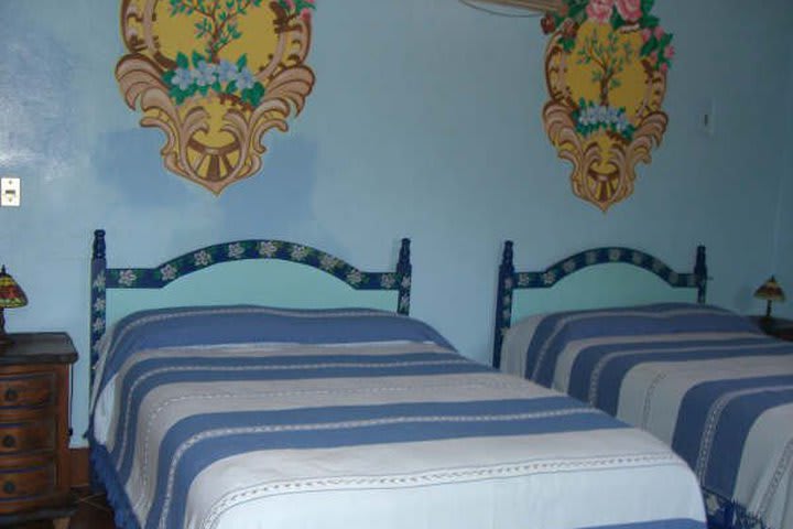 Suite with two double beds at Suites La Hacienda in Puerto Escondido