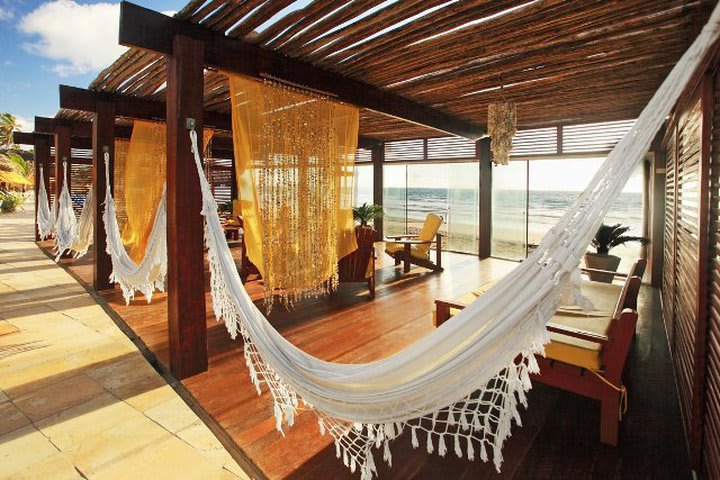 Sitting area with hammocks at the Porto de Galinhas Praia beach hotel 
