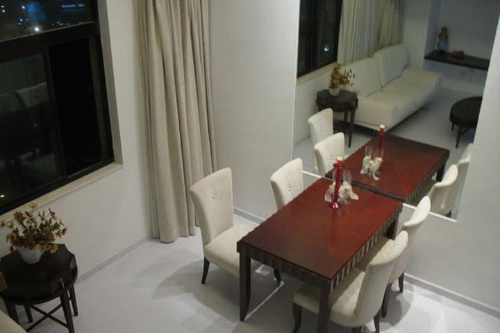 Table and chairs in an apartment at the Mayson Shanghai Bund Serviced Apartment hotel