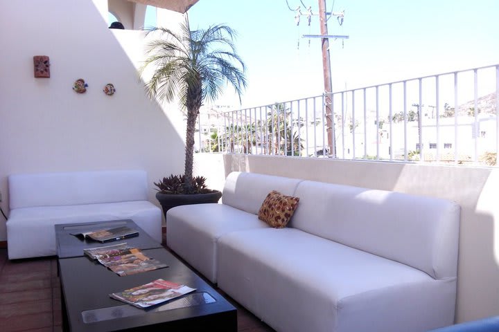 Sitting area with sofa next to the pool