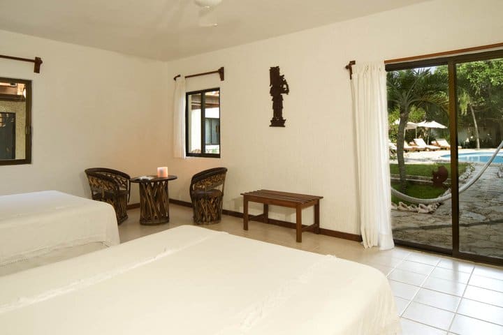 Deluxe guest room with pool view at the hotel on Na Balam Beach
