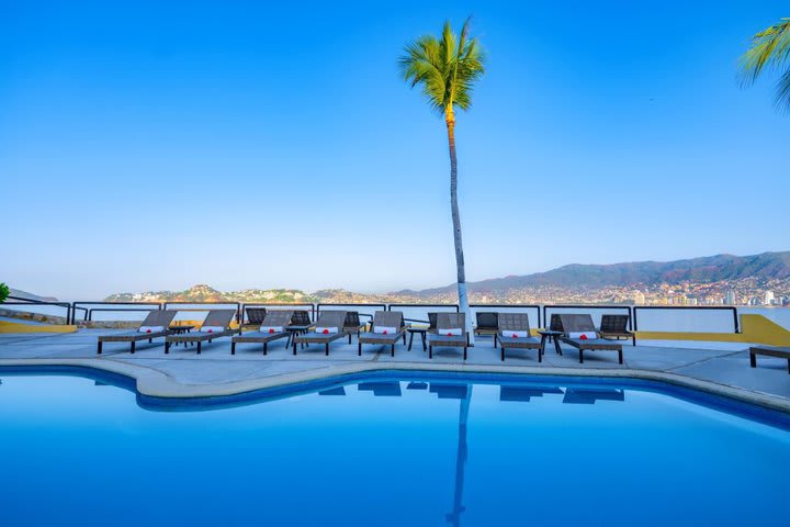 Sun loungers by the pool in the beach club